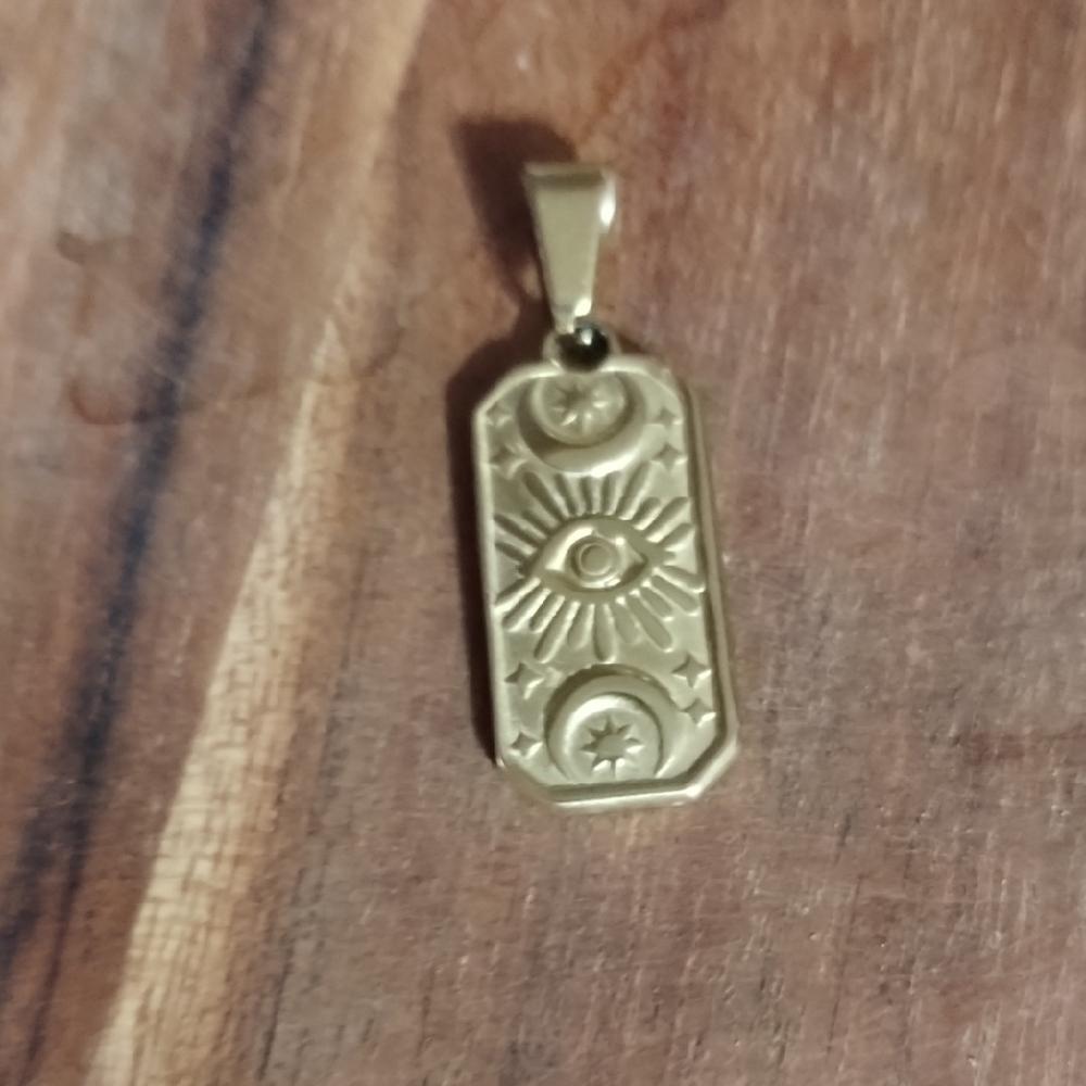 Cartouche Gold Color Pendant with Eye and Star Design